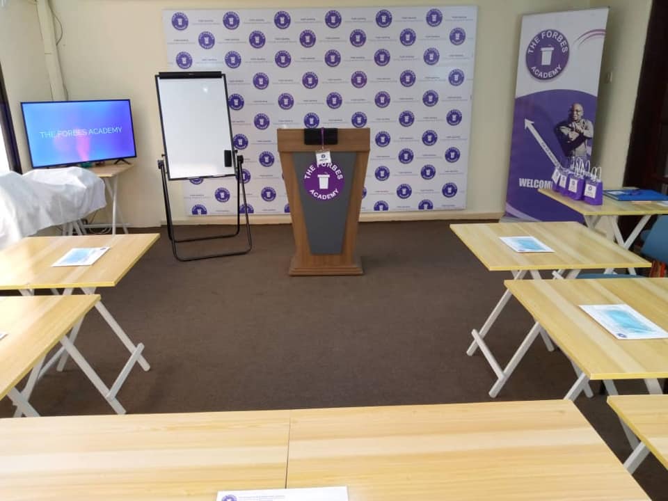 TFA classroom with branded backdrop