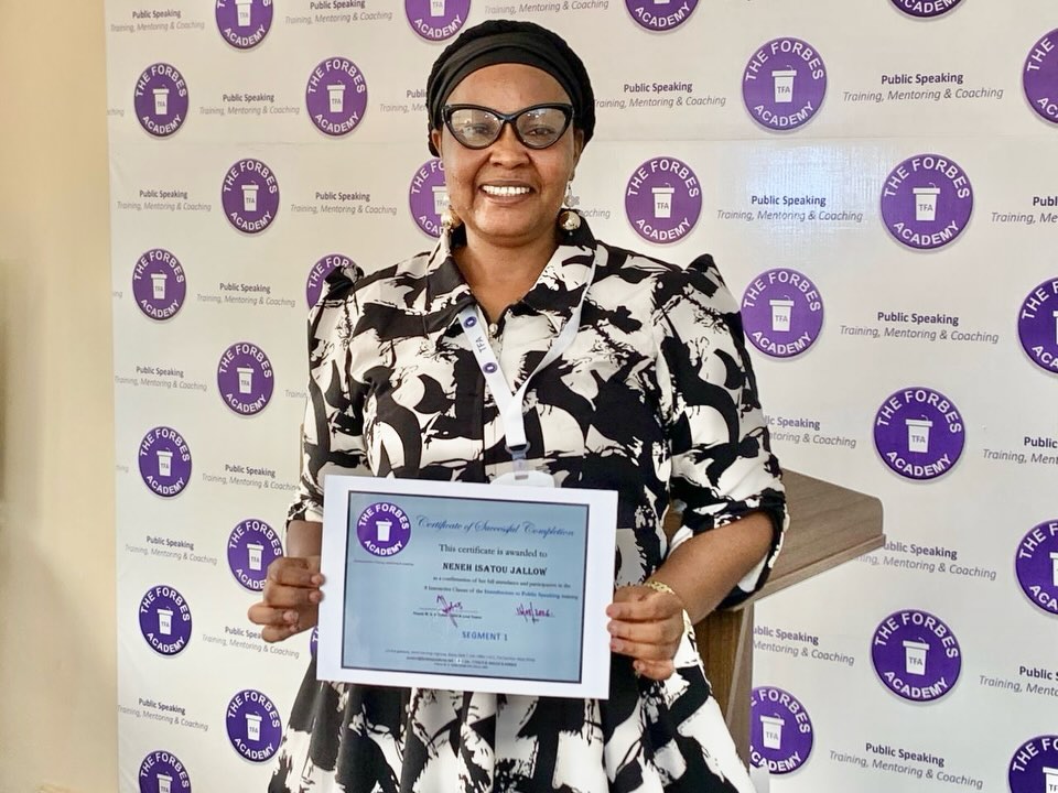 Graduate holding TFA certificate of completion